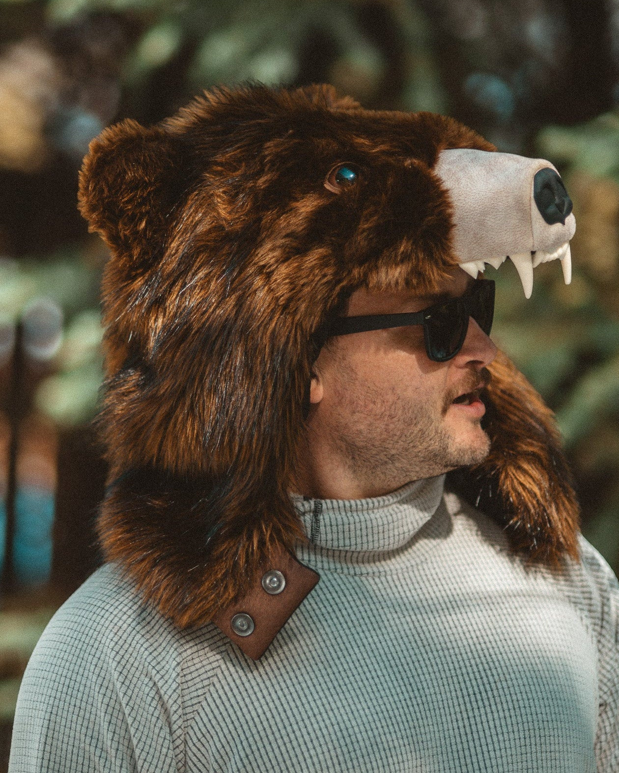 The wildcoat grizzly bearaclava v6, worn unfastened to show the new magnet attachment