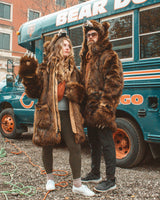 Two people wearing Wildcoat Grizzly Bear Parkas at a bears game