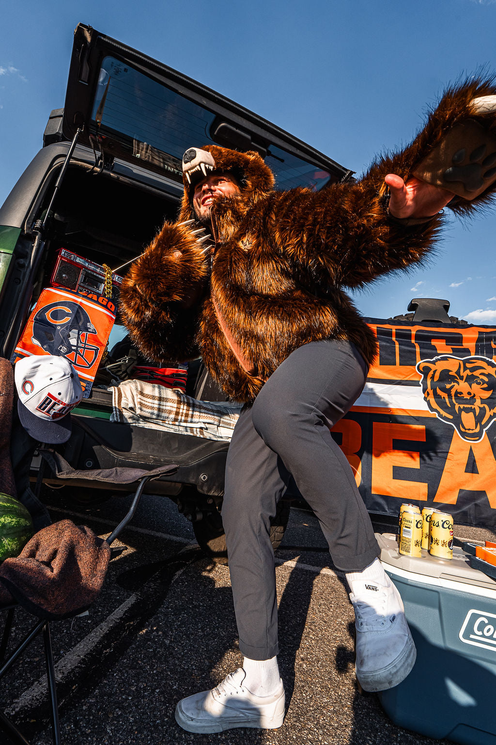 Chicago bears fan wearing the wildcoat grizzly bear bomber at a tailgate in chicago