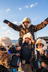 A group of philadelphia eagles fans wearing eagle wildcoats at a tailgate at lincoln financial field in philly. go birds