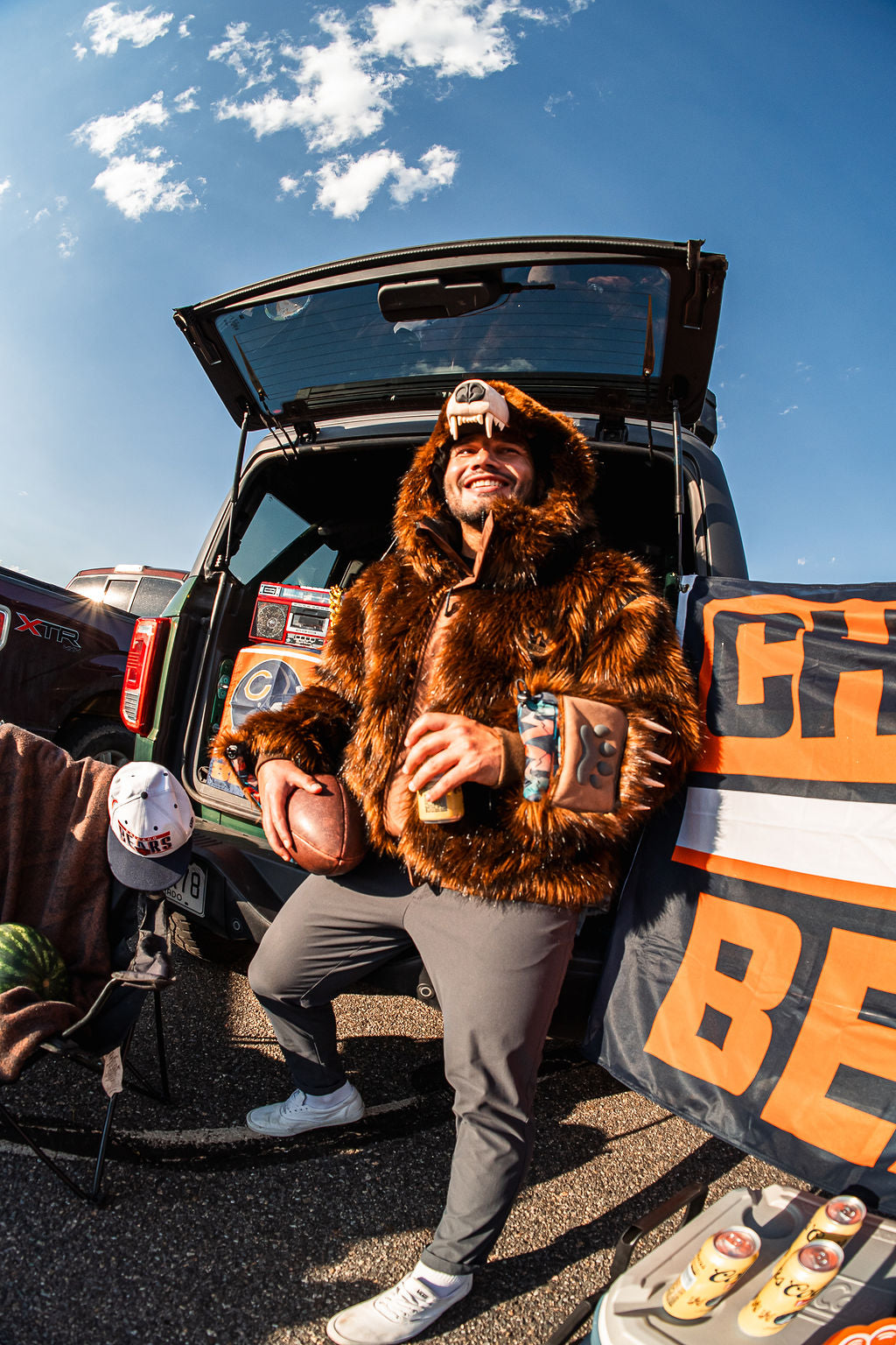 Chicago bears fan wearing the wildcoat grizzly bear bomber at a tailgate in chicago