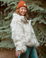 The Wildcoat Polar Bear Bomber on female model with mittens and hood detached