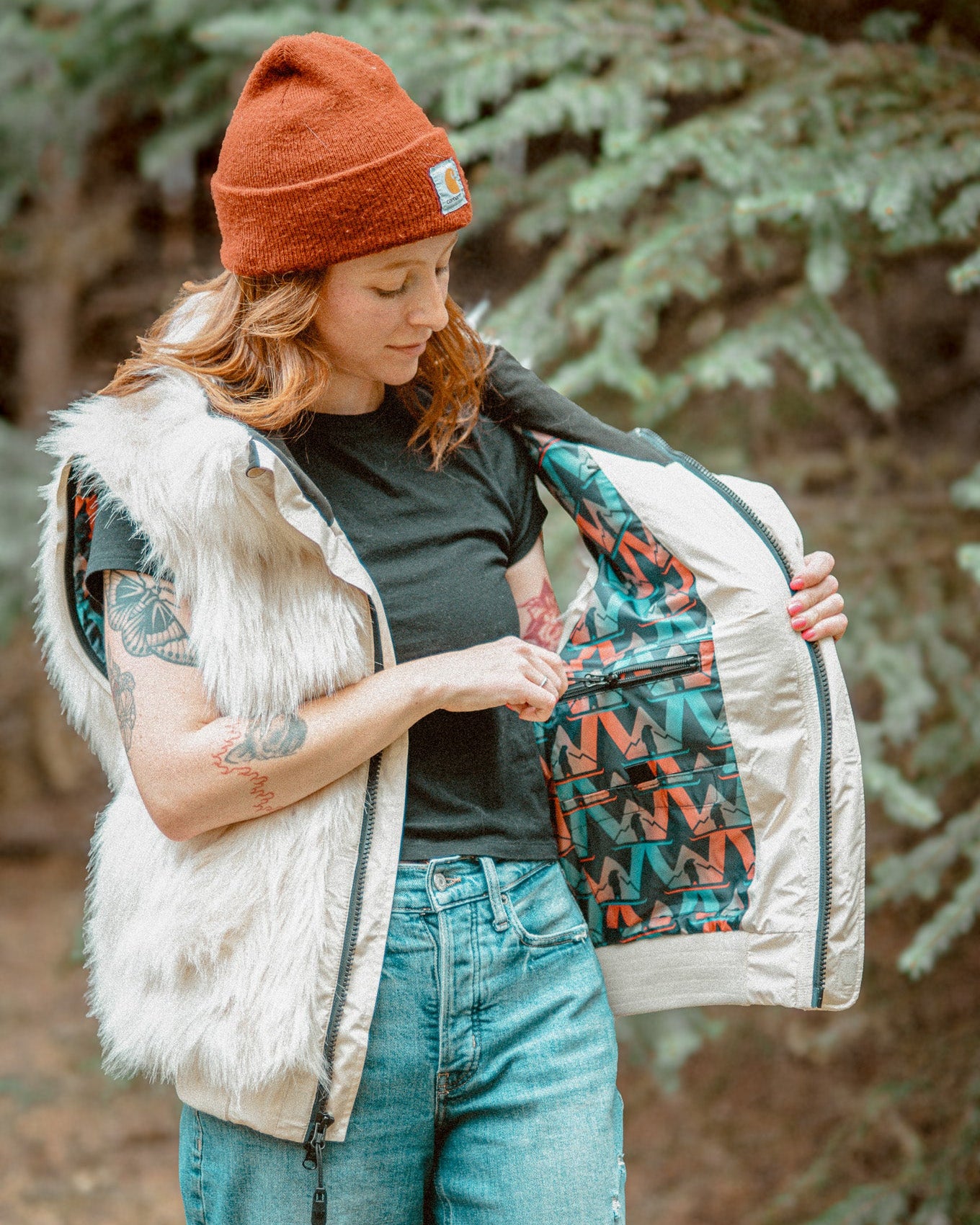 The Wildcoat Polar Bear Bomber on female model with sleeves and hood detached, showing inner pockets