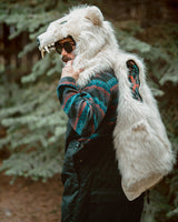 The Wildcoat Polar Bear Bomber on male model with sleeves detached, thrown over shoulder while wearing hood