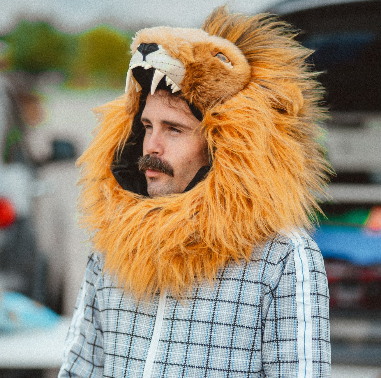 A man wearing the wildcoat v6 lion hood with the front collar enclosed