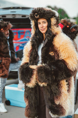 A woman wearing a plush, faux fur great white buffalo winter coat parka at a buffalo bills tailgate
