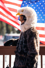 The wildcoat eagle parka v6shown on a skier with an american flag in the background