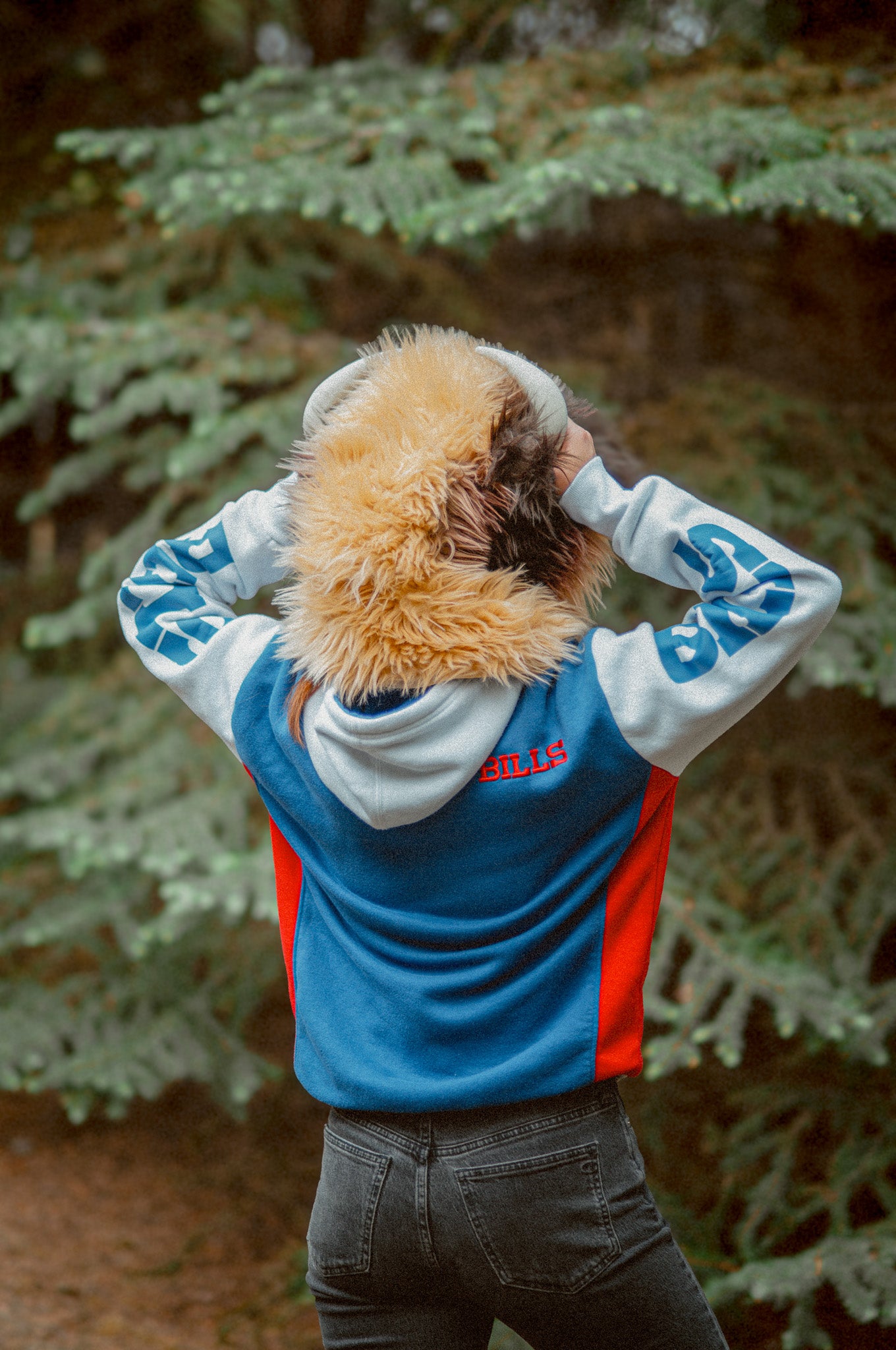 Woman wearing the wildcoat great white buffalo hood showing the back of the fur pattern