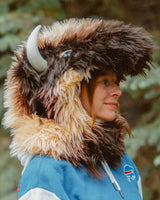 Woman wearing the wildcoat great white buffalo hood showing off the side profile of the hood, complete with realistic horn