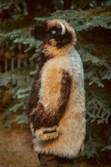 A man with a beard wearing the wildcoat great white buffalo coat, turning back to show off the side profile of the coat
