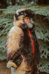 A man with a beard wearing the wildcoat great white buffalo coat looking off into the distance thinking about the buffalo bills