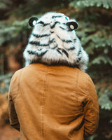 man wearing the wildcoat white tiger hood  showing the back of the hood