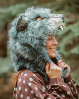 Woman smiling while wearing the wildcoat timberwolf howl cowl hood