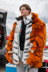 man wearing a hoodless wildcoat orange tiger faux fur parka coat at a tailgate