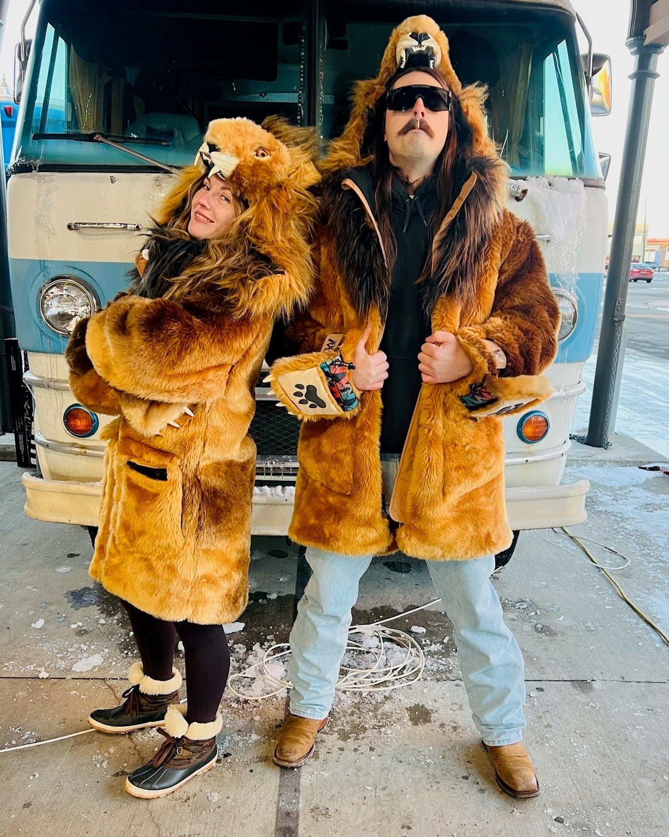 the wildcoat lion parka shown on two fans at the detroit lions tailgate