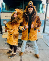 the wildcoat lion parka shown on two fans at the detroit lions tailgate