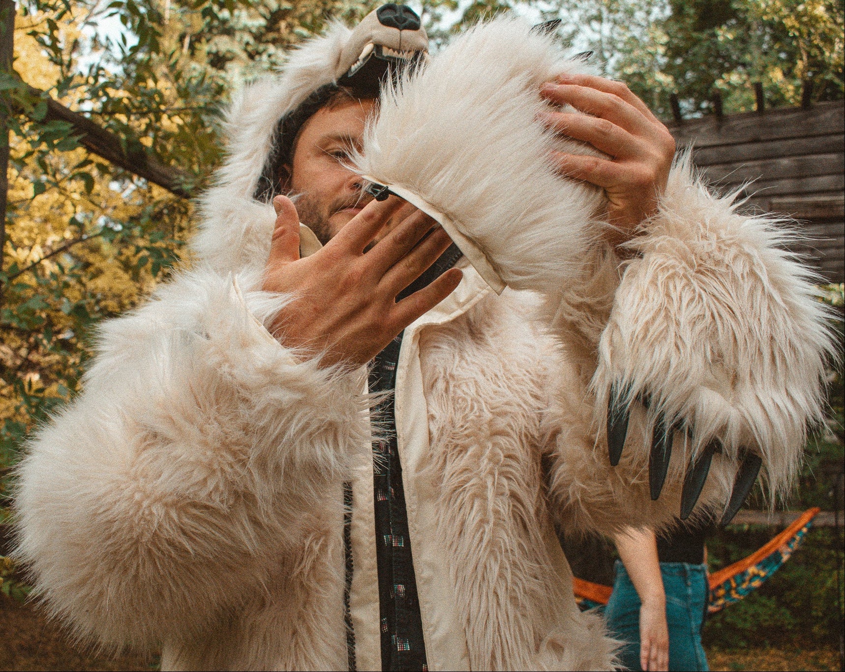 The wildcoat polar bear parka v6 shown with mitten zipped off