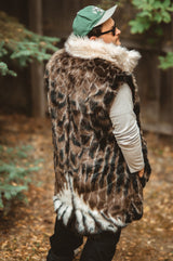 The wildcoat eagle parka v6 shown in vest mode with hood and sleeves removed and back of coat visible, man wearing philadelphia eagles hat