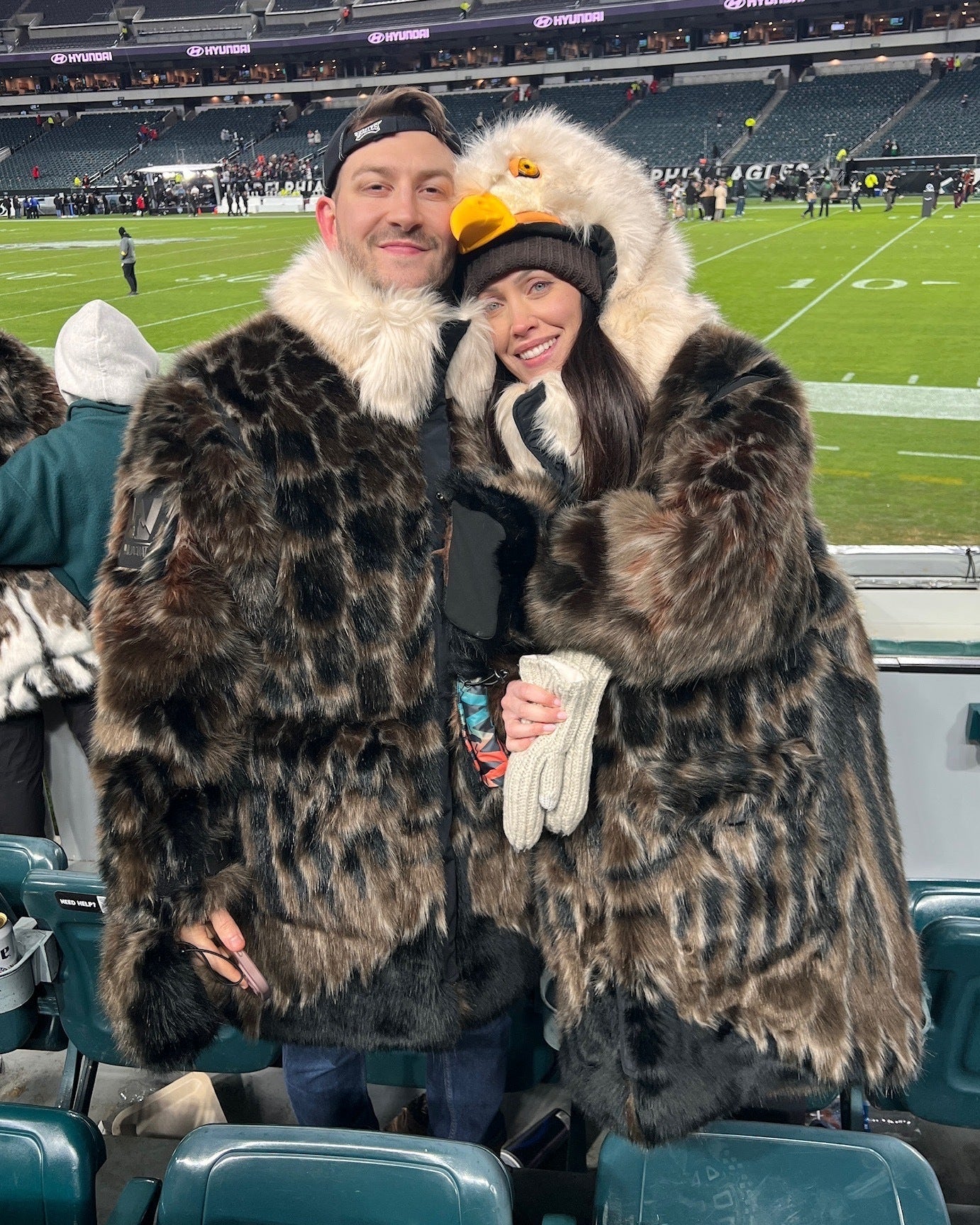 The wildcoat eagles parka v6 shown at a philadelphia eagles game on two fans